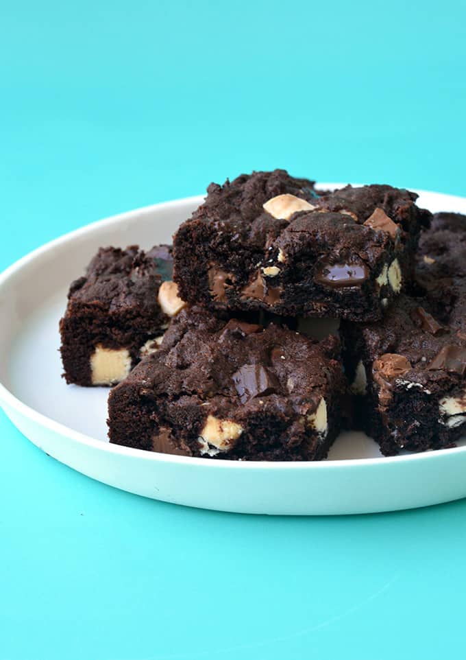 A white plate of Triple Chocolate Chunk Cookie Bars