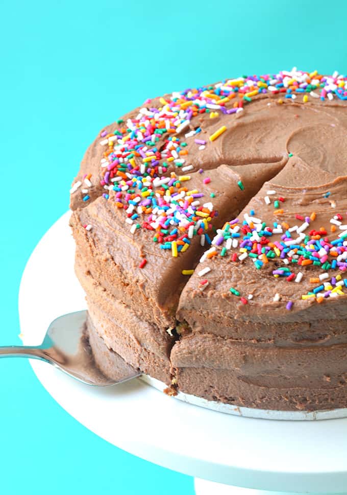 Two layer cake with chocolate frosting and sprinkles