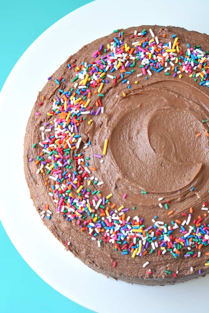 Top view of gorgeous cake covered in chocolate frosting and sprinkles