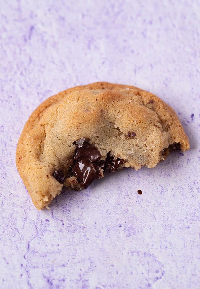 Half a cookie with chocolate melting out of it