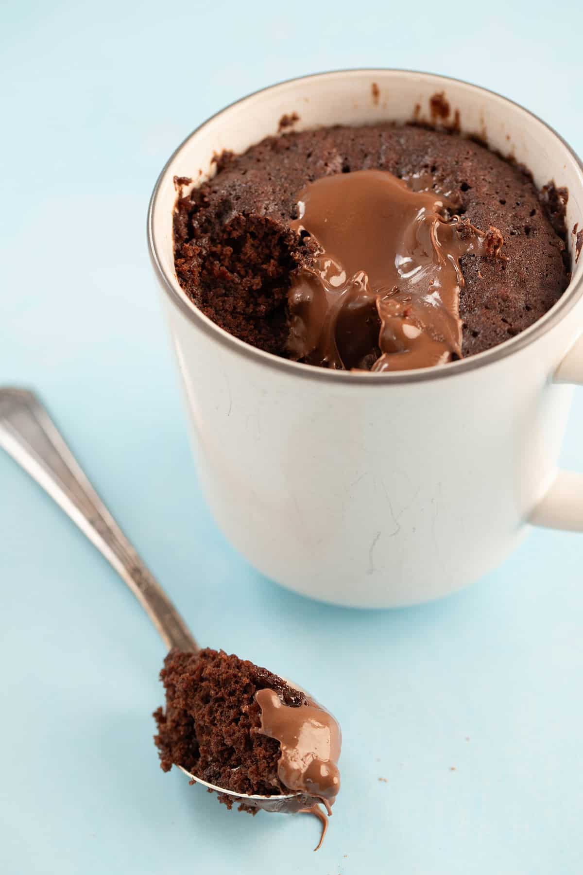 Nutella Mug Cake with a spoon.