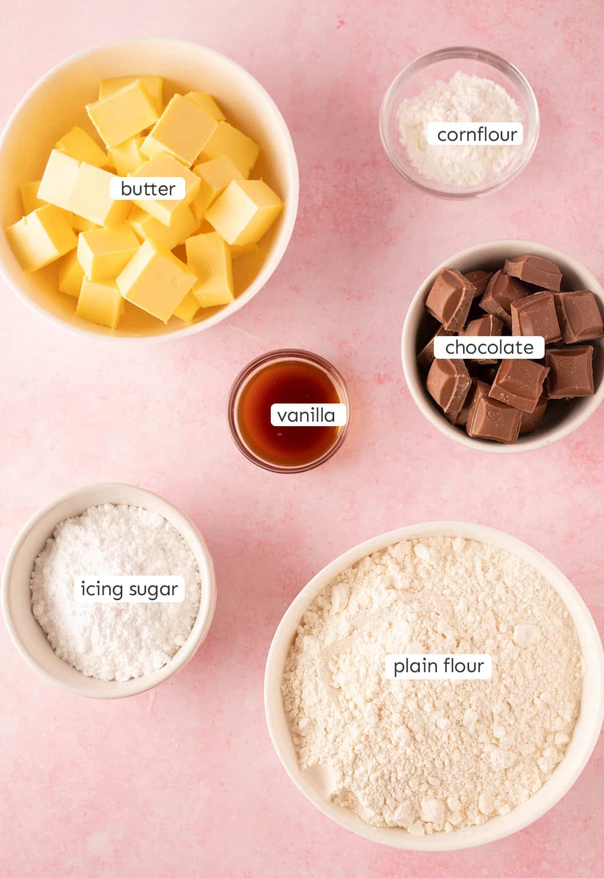 Top view of all six ingredients needed to make shortbread at home.