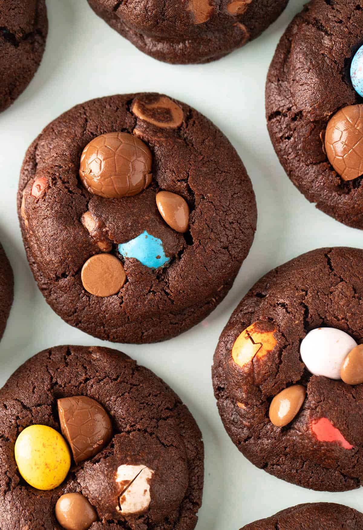 Close up of beautifully decorated Easter Cookies on a green backdrop.