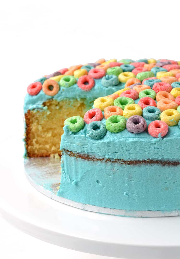 Froot Loop Cereal Milk Cake with a slice cut out