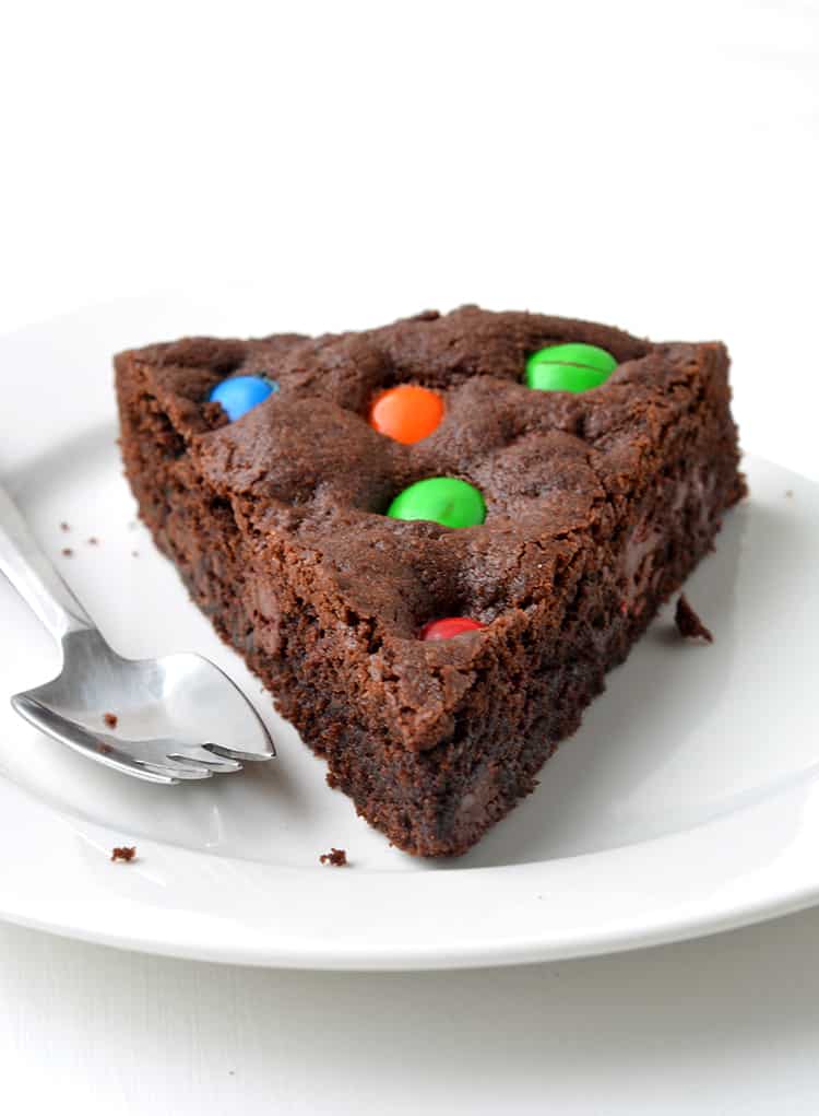 M&M Chocolate Cookie Cake on a white plate