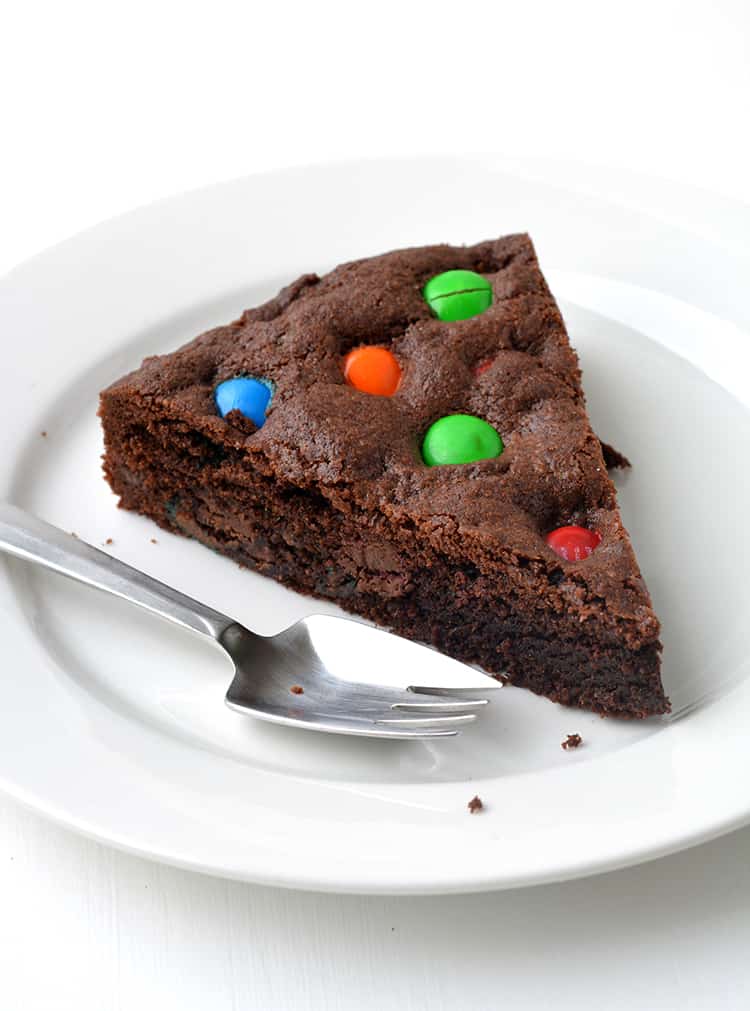 M&M Chocolate Cookie Cake on a white plate