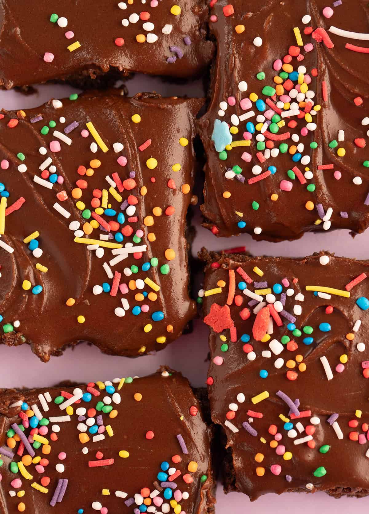 Close up of perfect chocolate slice with a fudgy chocolate frosting.
