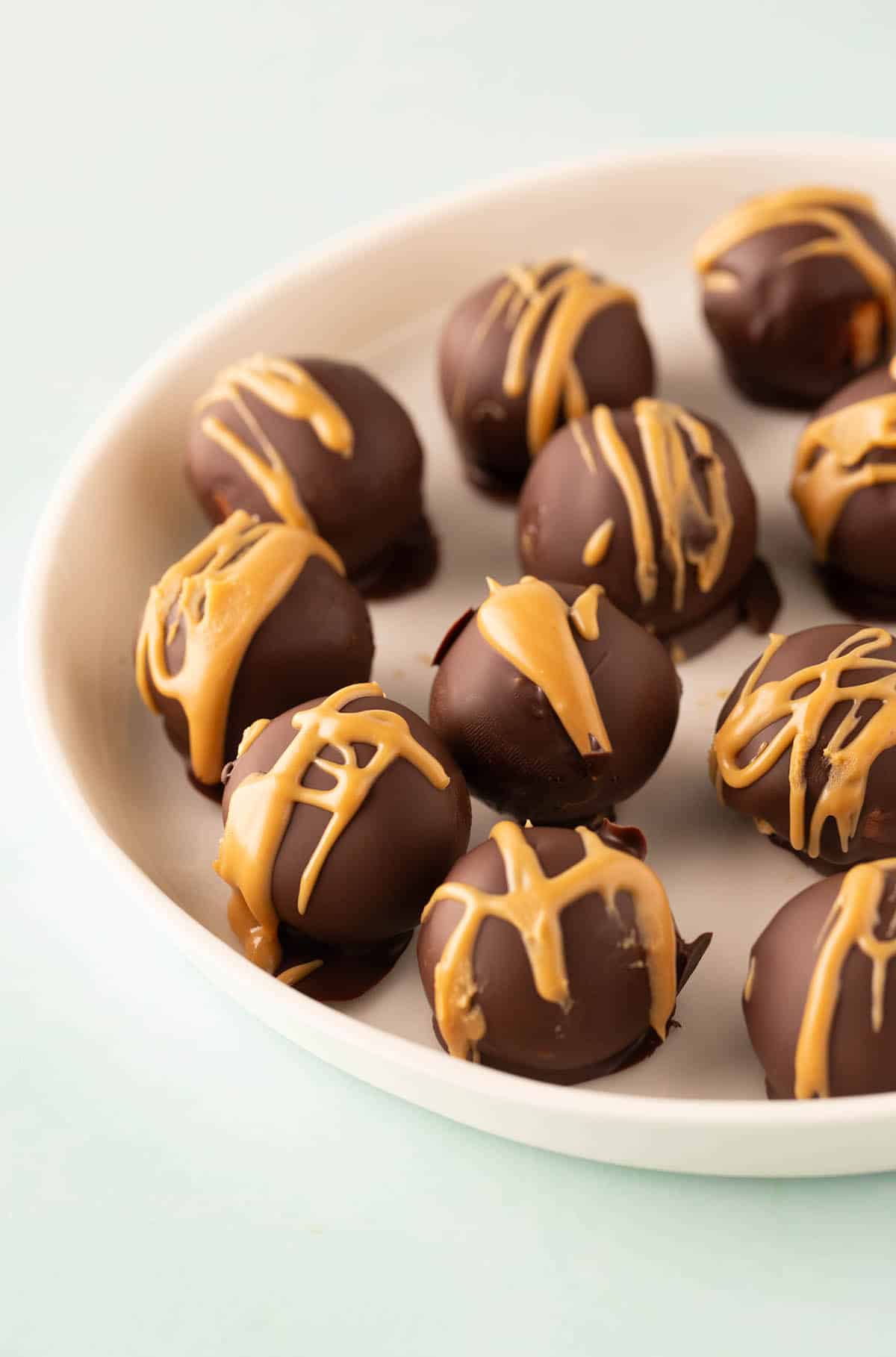 Peanut Butter Truffles on a white plate. 