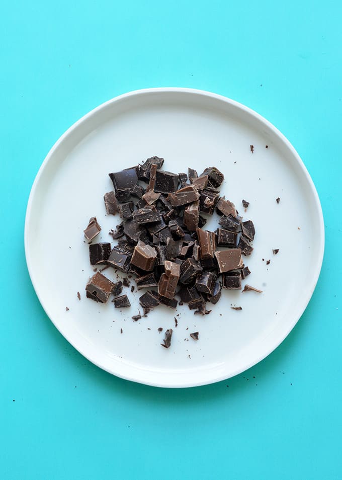 A white plate of chopped chocolate
