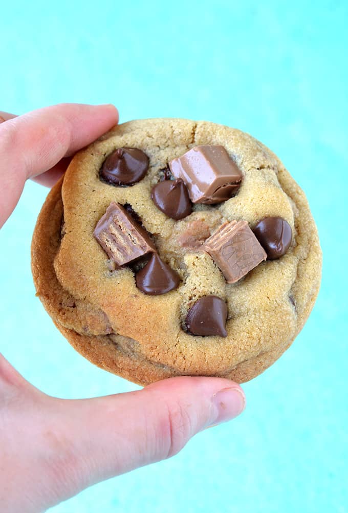 A hand holding a Kit Kat Chocolate Chip Cookie