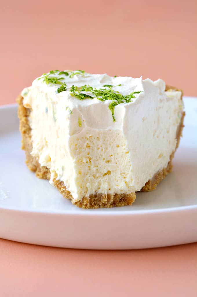 A slice of No Bake Key Lime Pie with a bite taken out of it