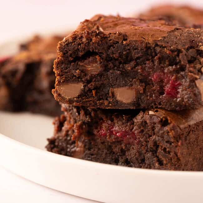 A stack of homemade chocolate raspberry brownies.