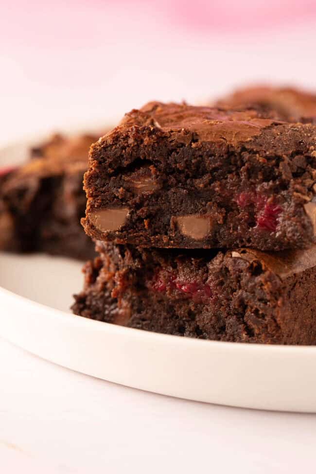 A stack of homemade chocolate raspberry brownies.