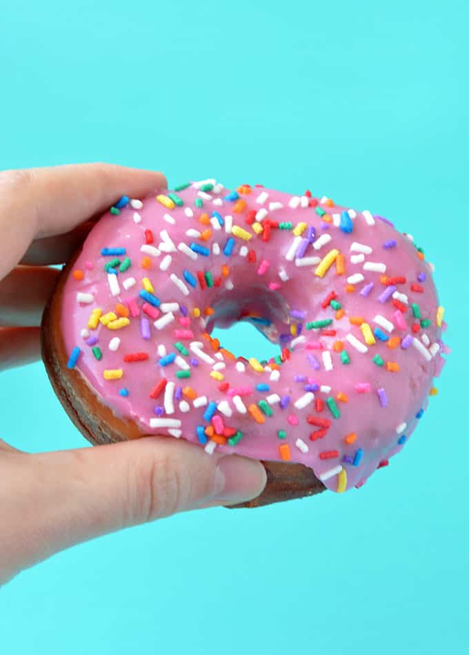 A hand holding a Homer Simpson Donut