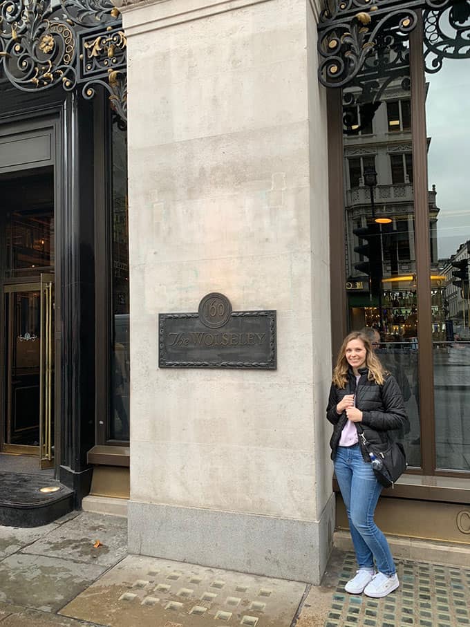 Jessica Holmes standing outside The Wolseley in London