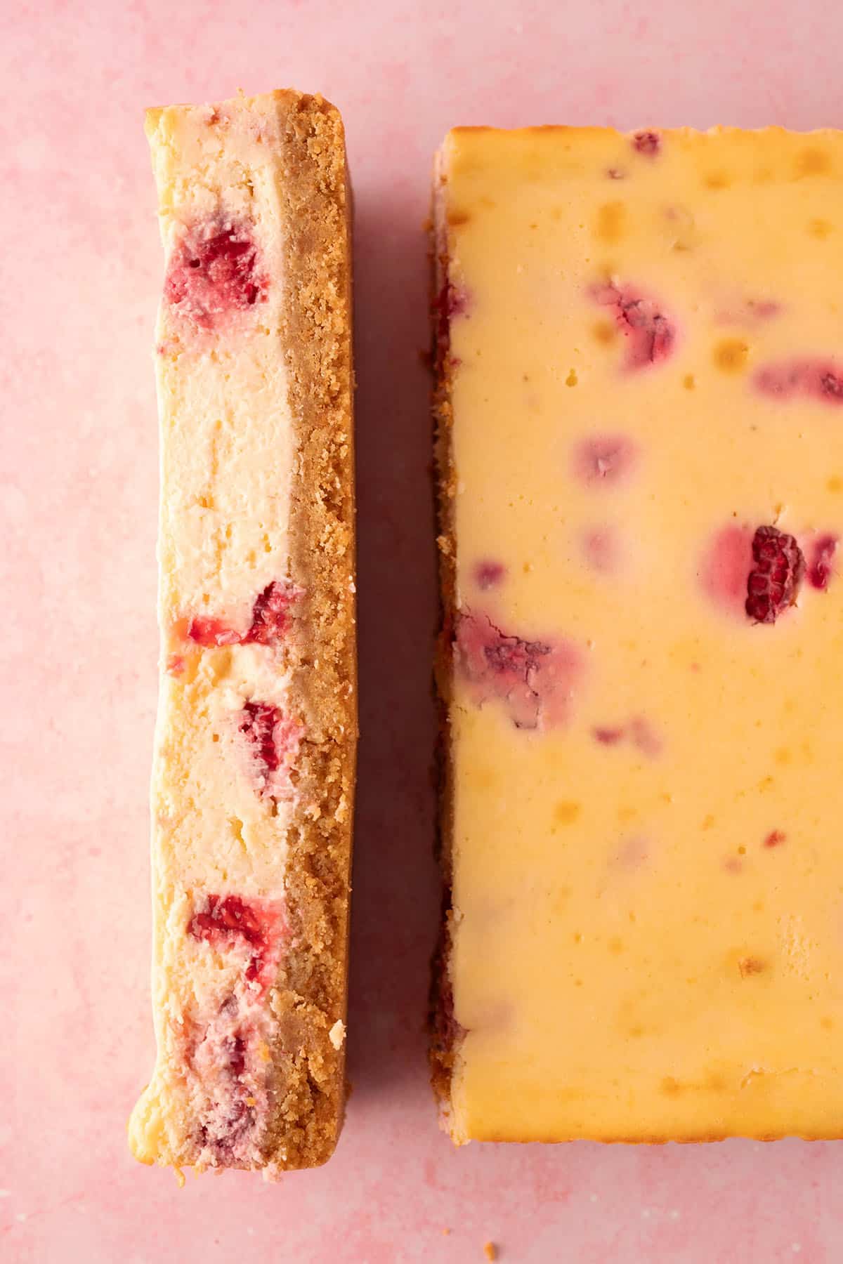 A beautiful photo of a sliced White Chocolate Cheesecake Bar.