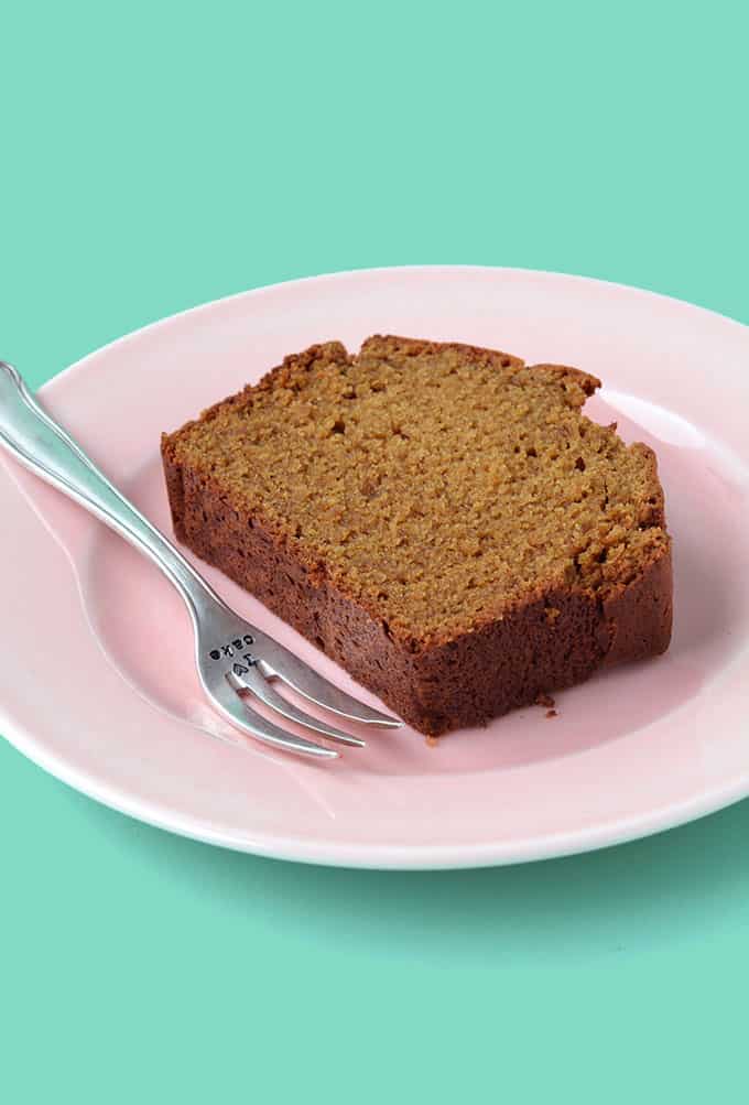 A piece of Gingerbread Cake on a pink plate