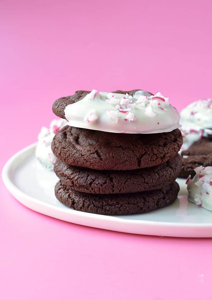 A stack of Peppermint Chocolate Cookies dipped in white chocolate