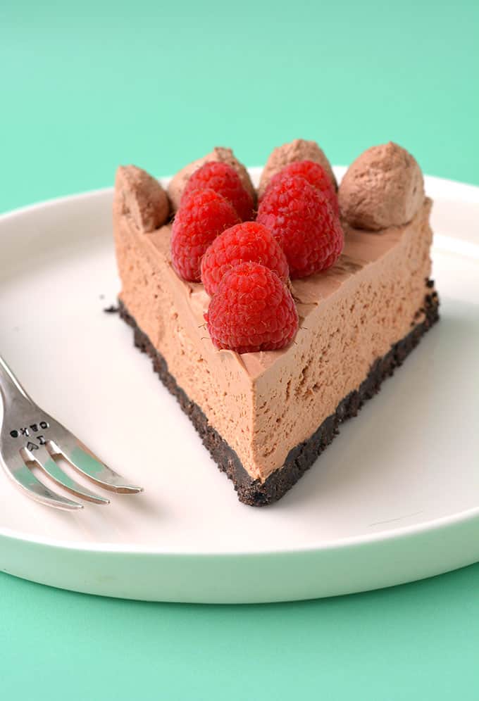 A slice of Chocolate Cheesecake on a white plate