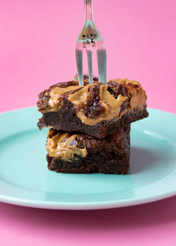 A stack of Peanut Butter Brownies with a fork in the middle