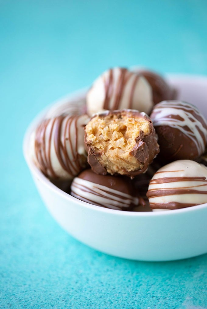 A close-up of Peanut Butter Balls in a white bowl