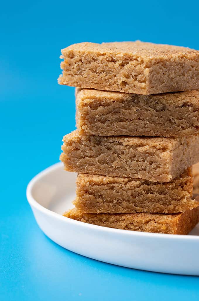 A stack of homemade Chai Spiced Blondies on a white plate