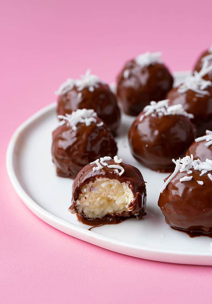 Chocolate coconut truffles with a bite taken out of it