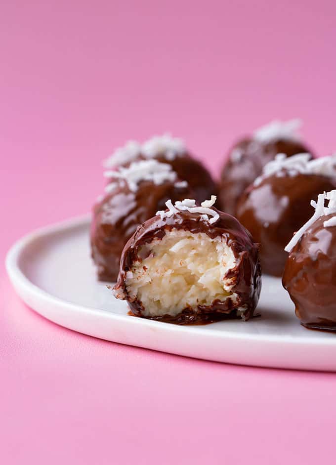 Chocolate coconut truffles with a bite taken out of it