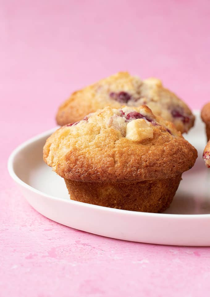 White Chocolate and Raspberry Muffins on a white plate