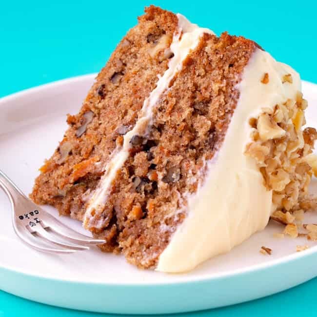 A big slice of Carrot Cake on a blue background