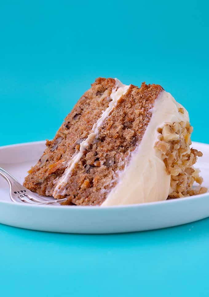 A piece of homemade Carrot Cake on a white plate