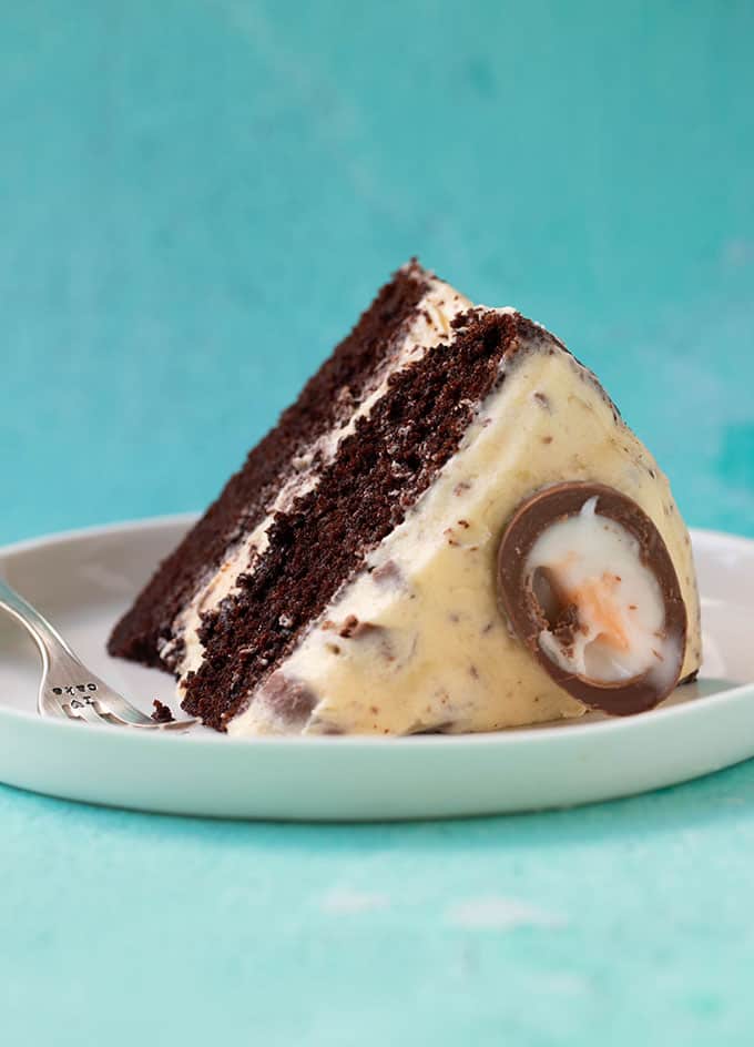 A slice of Creme Egg Chocolate Cake on a white plate