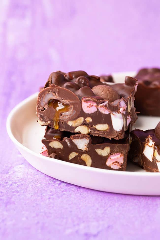 Slices of creme egg rocky road on a white plate