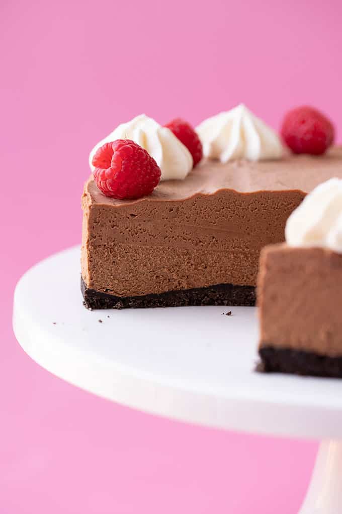 A close up shot of Chocolate Mousse Cake with a slice taken out of it