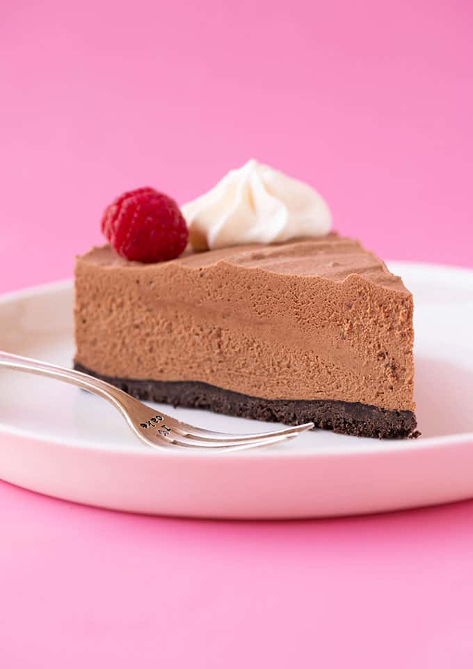 A slice of Chocolate Mousse Cake on a white plate