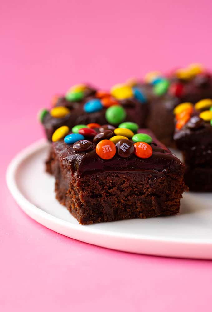 A chocolate frosted brownie topped with M&M's
