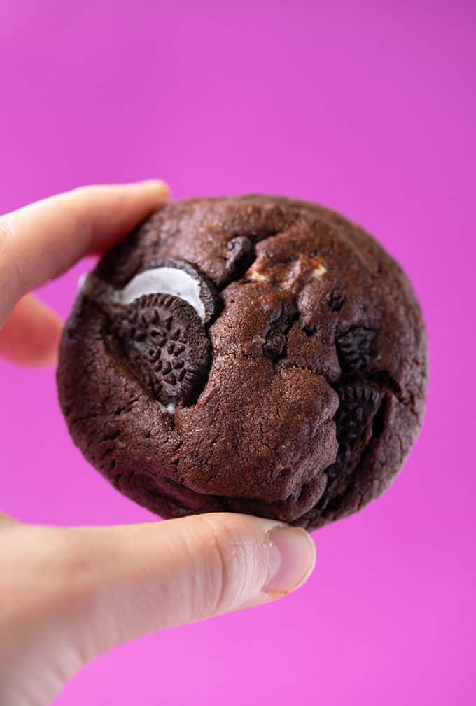 A hand holding a homeamde Chocolate Oreo Cookie