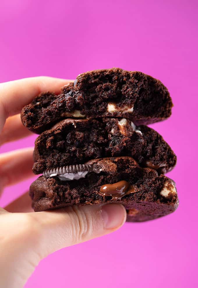 A hand holding a stack of homemade Chocolate Oreo Cookies