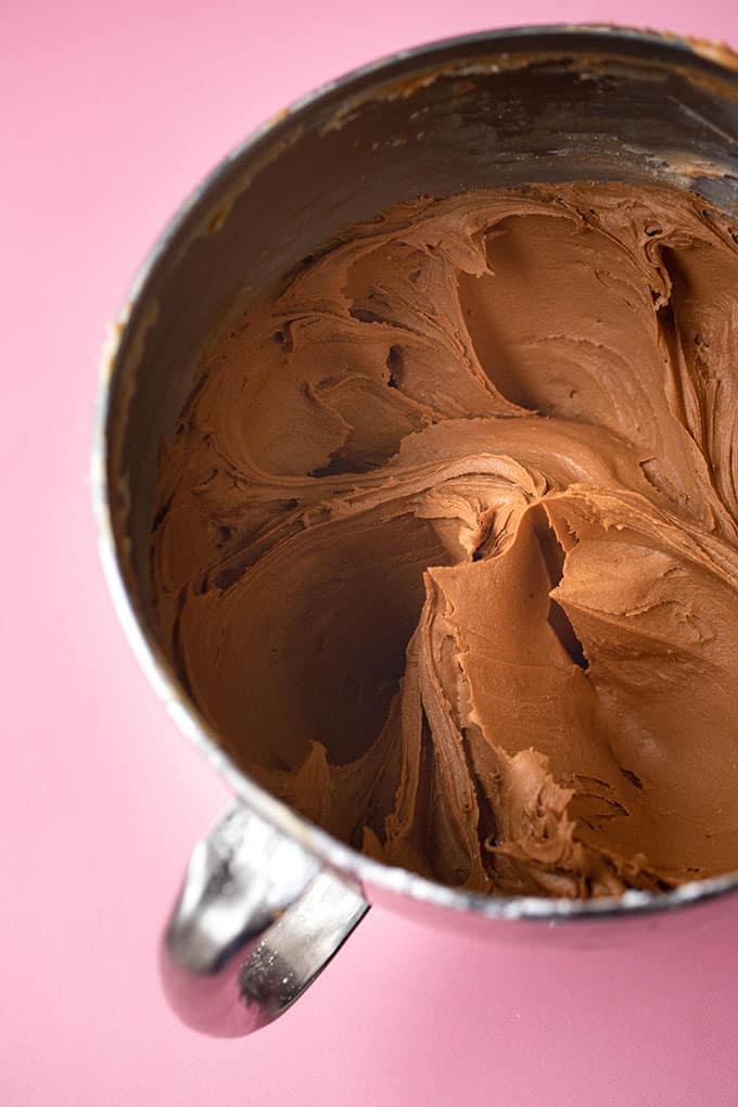 A mixing bowl filled with homemade chocolate frosting