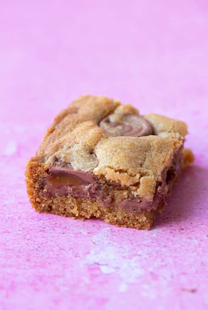 Close up view of a homemade Rolo Cookie Bar