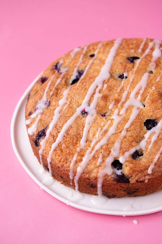 A whole Blueberry Cake with a drizzle of lemon