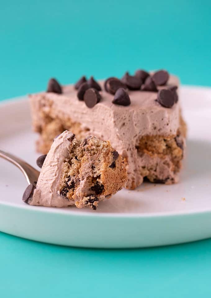 A slice of Chocolate Chip Cookie Icebox Cake with a bite taken out of it