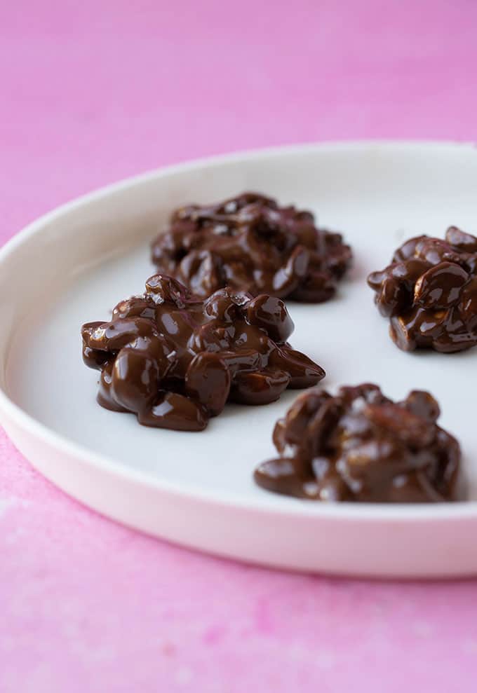 Chocolate Peanut Clusters on a white plate