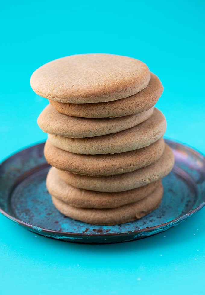 A tall stack of Honey Cookies on a blue plate