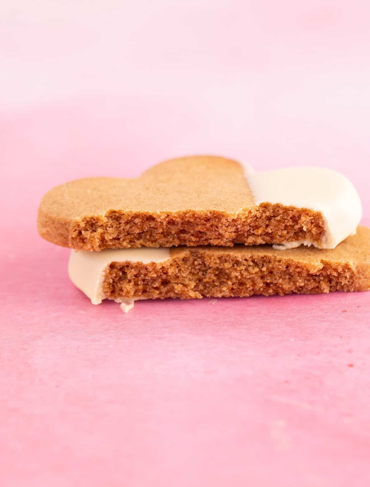 Close up of a honey cookie broken into two. 