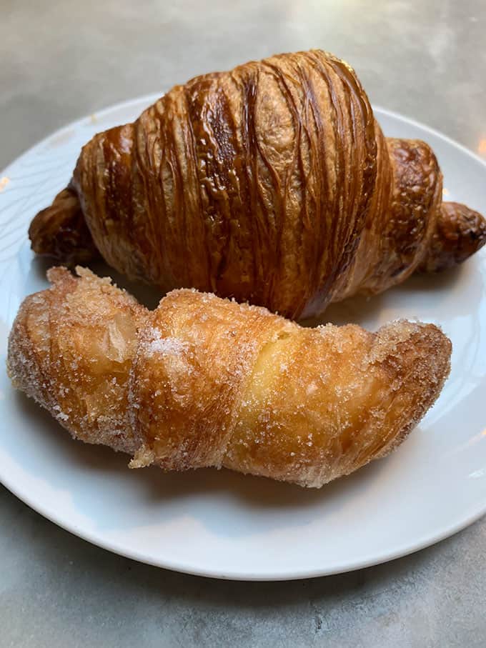 Croissants and pastries on a white plate