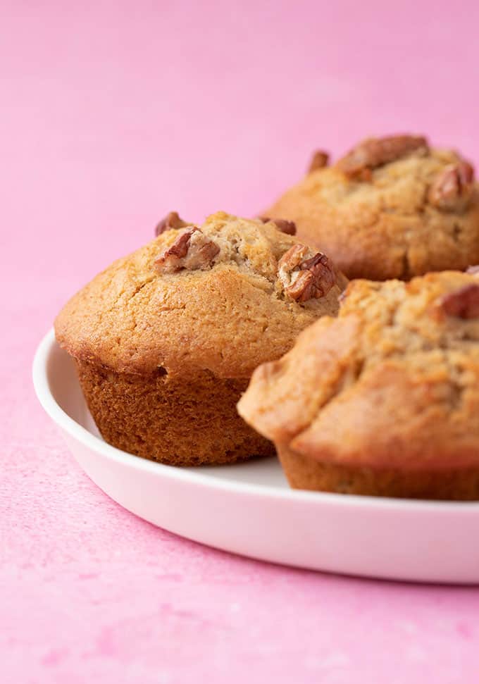 Banana Nut Muffins on a pink background