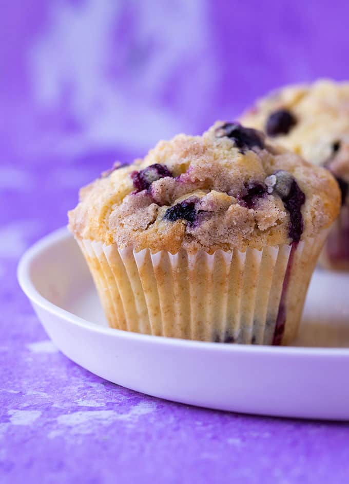 Homemade Blueberry Crumble Muffins on a white plate