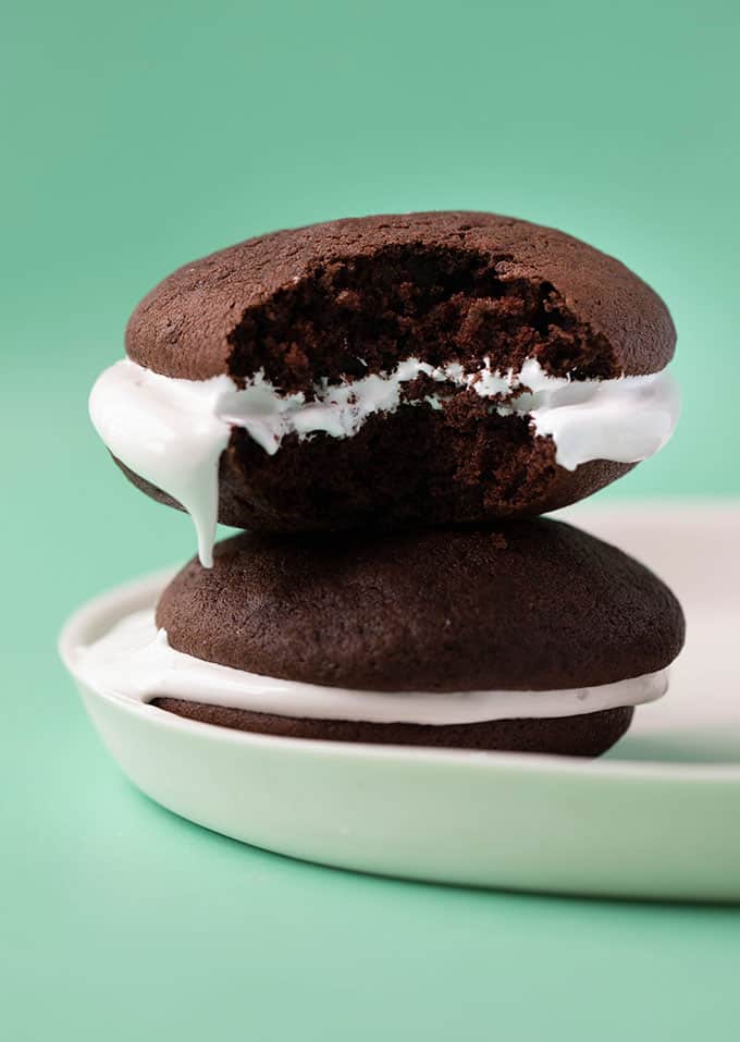 A stack of Chocolate Whoopie Pies on a white plate
