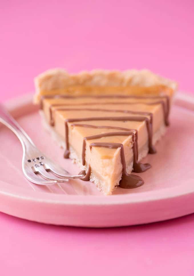 A slice of Honey Pie on a pink plate